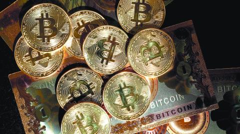 FILE PHOTO: Representations of cryptocurrency Bitcoin are seen in this illustration picture taken in Paris, France, March 9, 2024. REUTERS/Benoit Tessier/Illustration/File Photo