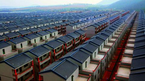 A general view of newly built houses at Dadun village of Lingshui ethnic Li Autonomous County, Hainan province, in this January 18, 2013 file photo. A property glut in some smaller cities raises questions over how far China's decade-long housing boom can last at a time when the fragile economy is more vulnerable than ever to a possible retreat in the red-hot property market.  REUTERS/Stringer/Files (CHINA - Tags: BUSINESS REAL ESTATE) CHINA OUT. NO COMMERCIAL OR EDITORIAL SALES IN CHINA