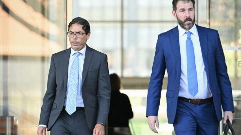 California physician Mark Chavez (L) and his attorney Matthew Binninger exit federal court in Los Angeles on October 2, 2024. - Chavez pleaded guilty to conspiring to distribute the drug ketamine to the late actor Matthew Perry, who died of a ketamine overdose in October 2023. (Photo by Patrick T. Fallon / AFP)