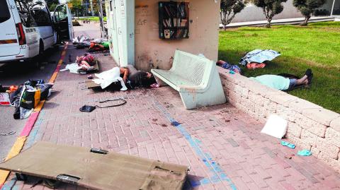 FILE PHOTO: SENSITIVE MATERIAL. THIS IMAGE MAY OFFEND OR DISTURB The bodies of people, some of them elderly, lie on a street after they were killed during a mass-infiltration by Hamas gunmen from the Gaza Strip, in Sderot, southern Israel  October 7, 2023. REUTERS/Ammar Awad/File Photo