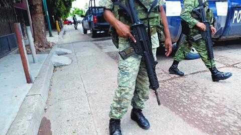 Soldiers stand guard near a checkpoint along a street in Culiacan, Mexico, September 9, 2018, REUTERS/Henry Romero