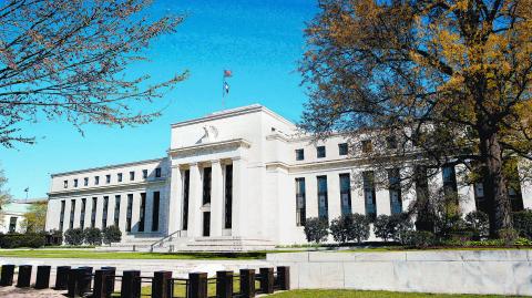 FILE PHOTO: The Federal Reserve Building stands in Washington April 3, 2012. REUTERS/Joshua Roberts/File Photo