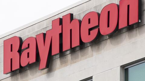 (FILES) The Raytheon logo is seen on a building in Annapolis Junction, Maryland, on March 11, 2019. - Raytheon, a subsidiary of major American defense contractor RTX, will pay more than $950 million to resolve charges of fraud and corruption linked to Qatari contracts, the US Justice Department announced on October 16, 2024. (Photo by Jim WATSON / AFP)