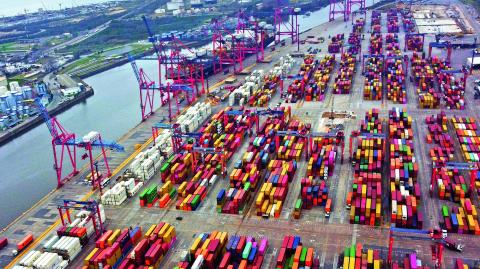 Aerial view showing containers in the port of Buenos Aires on the Rio de la Plata river (River Plate), on August 3, 2022. Economy 'super minister' Sergio Massa, who was appointed to oversee the economy, development and agriculture ministries as well as relations with international organizations, will be sworn-in on August 3. Argentina has suffered years of economic crisis, with some 37 percent of its population now living in poverty. Inflation for the first half of this year alone topped 36 percent, and is predicted to reach 80 percent by the year's end. (Photo by Luis ROBAYO / AFP)