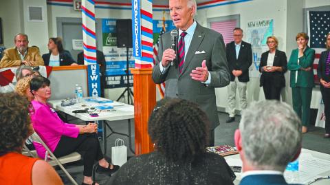 US President Joe Biden speaks to staff as he visits a New Hampshire Democratic coordinated campaign office in Concord, New Hampshire, on October 22, 2024. (Photo by Mandel NGAN / AFP)