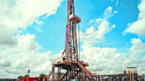 Drilling Rig with dramatic sky in dessert area