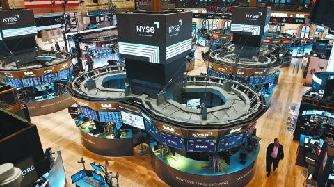 Traders work on the trading floor at the New York Stock Exchange (NYSE) in New York City, U.S., January 25, 2023. REUTERS/Andrew Kelly