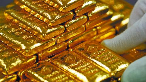 FILE PHOTO: An employee sorts gold bars in the Austrian Gold and Silver Separating Plant  in Vienna, Austria, December 15, 2017.  REUTERS/Leonhard Foeger/File Photo