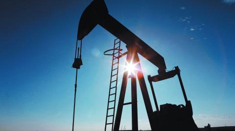 FILE PHOTO: The sun is seen behind a crude oil pump jack in the Permian Basin in Loving County, Texas, U.S., November 22, 2019. Picture taken November 22, 2019.  REUTERS/Angus Mordant/File Photo