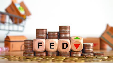 The Federal Reserve ( FED ) to control interest rates. Wooden blocks FED on coins stack. American economy and business. Federal Reserve Bank Interest rates rise policy. FED concept.Inflation