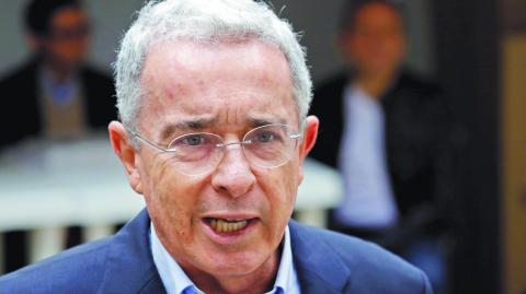 FILE PHOTO: Colombia's former president Alvaro Uribe Velez speaks to the news media after casting his vote at a polling station, during the presidential election in Bogota, Colombia May 27, 2018. REUTERS/Carlos Garcia Rawlins/File Photo