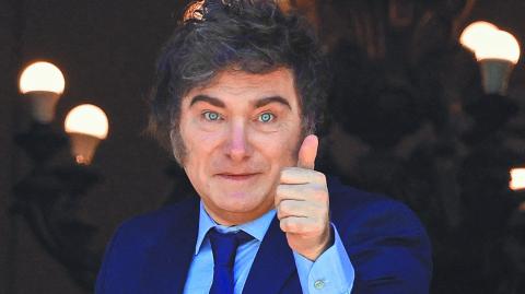 Argentina's President Javier Milei gestures from a balcony of the Casa Rosada Government House during the visit of Italy's Prime Minister Giorgia Meloni (not pictured), in Buenos Aires, Argentina November 20, 2024. REUTERS/Agustin Marcarian