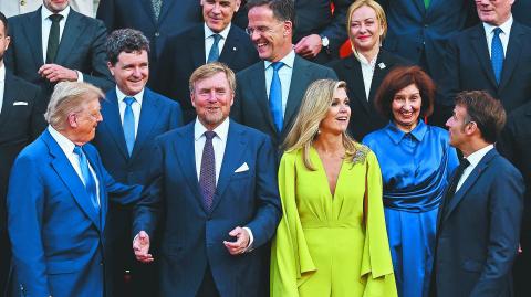 U.S. President Donald Trump, Dutch King Willem-Alexander and Dutch Queen Maxima, France's President Emmanuel Macron,  Italian Prime Minister Giorgia Meloni, Canadian Prime Minister Mark Carney, Britain's Prime Minister Keir Starmer and NATO Secretary General Mark Rutte pose for a picture ahead of a dinner hosted by Dutch King Willem-Alexander and Dutch Queen Maxima, on the sidelines of a NATO Summit, at Huis ten Bosch Palace in The Hague, Netherlands June 24, 2025. REUTERS/Christian Hartmann/Pool