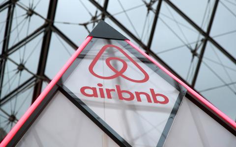 FILE PHOTO: The Airbnb logo is seen on a little mini pyramid under the glass Pyramid of the Louvre museum in Paris, France, March 12, 2019. REUTERS/Charles Platiau/File Photo-NARCH/NARCH30