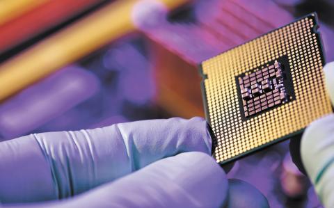 Computer support engineer installing processor. Microprocessor with clearly visible silicon core and cache chip. Installation of computer processor in the socket.