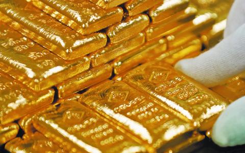 FILE PHOTO: An employee sorts gold bars in the Austrian Gold and Silver Separating Plant  in Vienna, Austria, December 15, 2017.  REUTERS/Leonhard Foeger/File Photo-NARCH/NARCH30