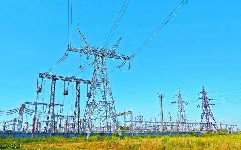 Image of high voltage substation. Distribution electrical power of pylons and equipment.