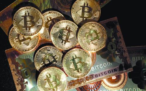 FILE PHOTO: Representations of cryptocurrency Bitcoin are seen in this illustration picture taken in Paris, France, March 9, 2024. REUTERS/Benoit Tessier/Illustration/File Photo