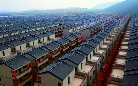 A general view of newly built houses at Dadun village of Lingshui ethnic Li Autonomous County, Hainan province, in this January 18, 2013 file photo. A property glut in some smaller cities raises questions over how far China's decade-long housing boom can last at a time when the fragile economy is more vulnerable than ever to a possible retreat in the red-hot property market.  REUTERS/Stringer/Files (CHINA - Tags: BUSINESS REAL ESTATE) CHINA OUT. NO COMMERCIAL OR EDITORIAL SALES IN CHINA