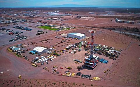 Aerial view of an industrial park, in Anelo, Neuquen province, Argentina, in the Vaca Muerta Formation, on November 28, 2019. Vaca Muerta is an enormous non-conventional oil and gas deposit nestled in a geologic formation. It occupies over 30,000 square kilometers in the states of Neuquen, Rio Negro, La Pampa and Mendoza and provides 43% of the total oil production and 60% of the gas production of Argentina. (Photo by Emiliano Lasalvia / AFP)