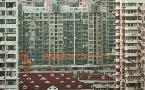 A general view shows buildings in a residential area in the Jing'an district in Shanghai on September 28, 2024. (Photo by Hector RETAMAL / AFP)