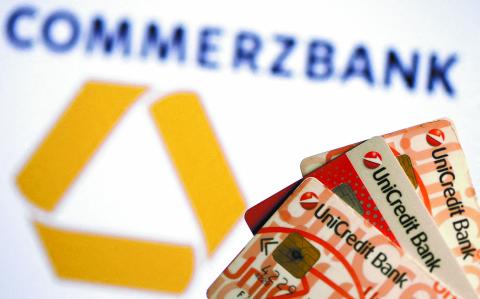 FILE PHOTO: UniCredit credit cards are seen in front of a displayed Commerzbank logo in this illustration taken September 20, 2017. REUTERS/Dado Ruvic/Illustration/File Photo