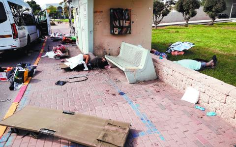 FILE PHOTO: SENSITIVE MATERIAL. THIS IMAGE MAY OFFEND OR DISTURB The bodies of people, some of them elderly, lie on a street after they were killed during a mass-infiltration by Hamas gunmen from the Gaza Strip, in Sderot, southern Israel  October 7, 2023. REUTERS/Ammar Awad/File Photo