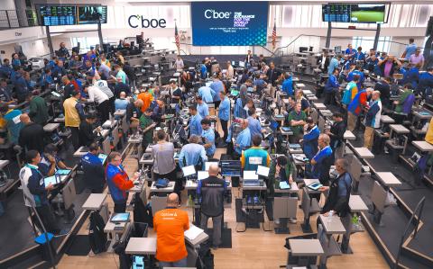 CHICAGO, ILLINOIS - JUNE 12: Traders work in the S&P options pit at the Cboe Global Markets exchange while awaiting news from the Fed meeting on June, 12, 2024 in Chicago, Illinois. The Federal Reserve today held interest rates at their current range of 5.25% to 5.5%, but revised its outlook for rate cuts to just one in 2024.   Scott Olson/Getty Images/AFP (Photo by SCOTT OLSON / GETTY IMAGES NORTH AMERICA / Getty Images via AFP)