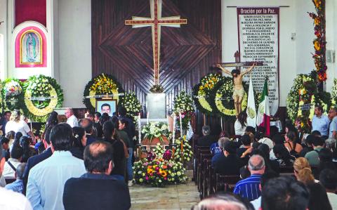 Relatives and friends of Chilpancingo Mayor Alejandro Arcos take part in a mass prior to his funeral in Chilpancingo, Guerrero State, Mexico, on October 7, 2024. - The mayor of the southern Mexican city of Chilpancingo, Alejandro Arcos, was murdered on Sunday after just six days in office, a crime that could be investigated by federal prosecutors, President Claudia Sheinbaum said on Monday. (Photo by Eduardo GUERRERO / AFP)