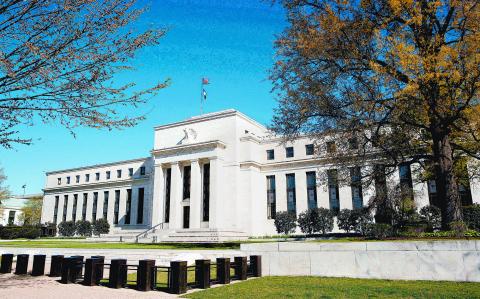 FILE PHOTO: The Federal Reserve Building stands in Washington April 3, 2012. REUTERS/Joshua Roberts/File Photo