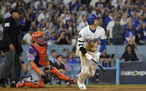 Oct 13, 2024; Los Angeles, California, USA; Los Angeles Dodgers two-way player Shohei Ohtani (17) hits a RBI double against the New York Mets in the fourth inning during game one of the NLCS for the 2024 MLB Playoffs at Dodger Stadium. Mandatory Credit: Jayne Kamin-Oncea-Imagn Images