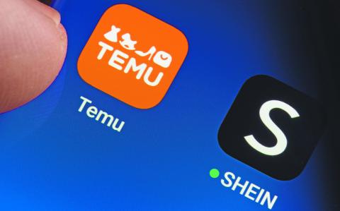 TEMU and SHEIN apps seen on the screen of smartphone and finger pointing at one of them. Temu app and Shein app are chinese budget shopping platforms. Stafford, United Kindom, May 2, 2023