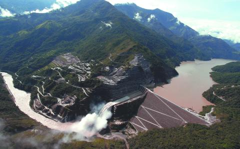 General view of the Hidroituango Hydroelectric Project, near the municipality of Ituango, Antioquia Department, Colombia, taken on October 13, 2022. The Hidroituango Hydroelectric Project is expected to start generating energy in November of this year after its construction was delayed for more than two years due to the collapse of one of the tunnels in April 2018. (Photo by Juan Pablo Pino / AFP)