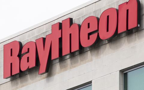 (FILES) The Raytheon logo is seen on a building in Annapolis Junction, Maryland, on March 11, 2019. - Raytheon, a subsidiary of major American defense contractor RTX, will pay more than $950 million to resolve charges of fraud and corruption linked to Qatari contracts, the US Justice Department announced on October 16, 2024. (Photo by Jim WATSON / AFP)