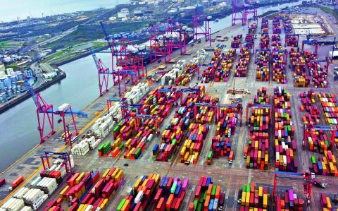 Aerial view showing containers in the port of Buenos Aires on the Rio de la Plata river (River Plate), on August 3, 2022. Economy 'super minister' Sergio Massa, who was appointed to oversee the economy, development and agriculture ministries as well as relations with international organizations, will be sworn-in on August 3. Argentina has suffered years of economic crisis, with some 37 percent of its population now living in poverty. Inflation for the first half of this year alone topped 36 percent, and is predicted to reach 80 percent by the year's end. (Photo by Luis ROBAYO / AFP)