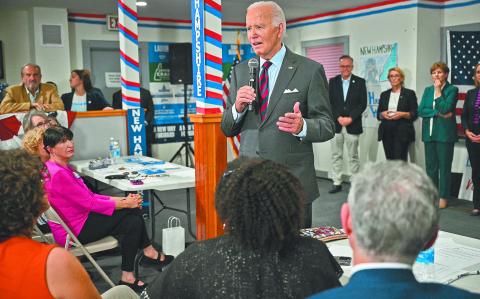 US President Joe Biden speaks to staff as he visits a New Hampshire Democratic coordinated campaign office in Concord, New Hampshire, on October 22, 2024. (Photo by Mandel NGAN / AFP)