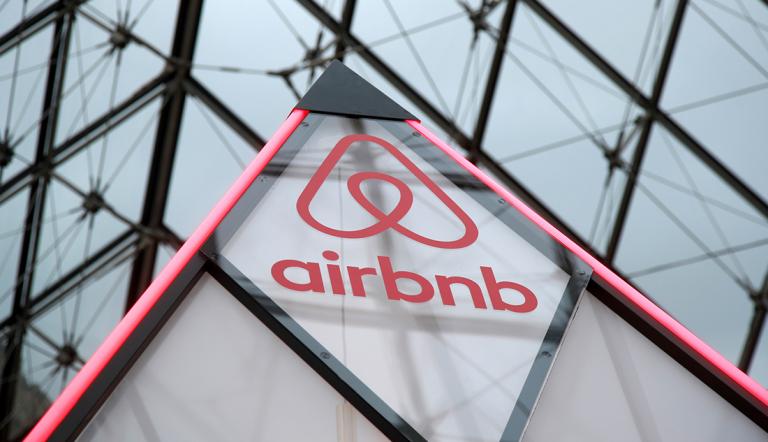 FILE PHOTO: The Airbnb logo is seen on a little mini pyramid under the glass Pyramid of the Louvre museum in Paris, France, March 12, 2019. REUTERS/Charles Platiau/File Photo-NARCH/NARCH30