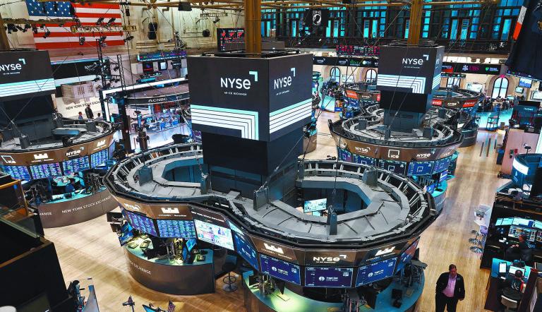 Traders work on the trading floor at the New York Stock Exchange (NYSE) in New York City