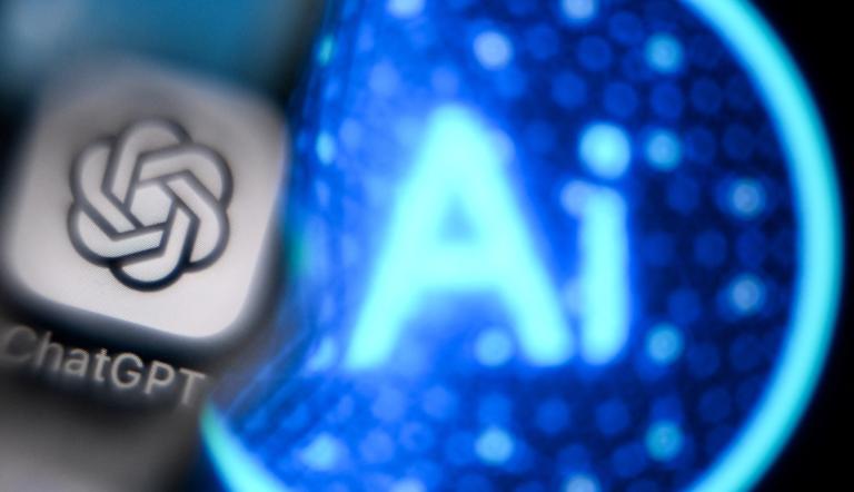 A photo taken on November 27, 2024 shows the logo of the ChatGPT application developed by US artificial intelligence research organization OpenAI on a smartphone screen (L) and the letters AI on a laptop screen in Frankfurt am Main, western Germany. (Photo by Kirill KUDRYAVTSEV / AFP)