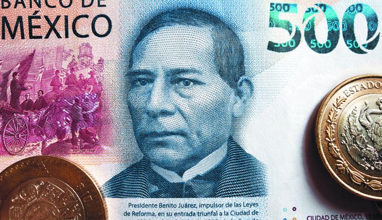 approach to the mexican banknote of 500 pesos and coins, background and texture