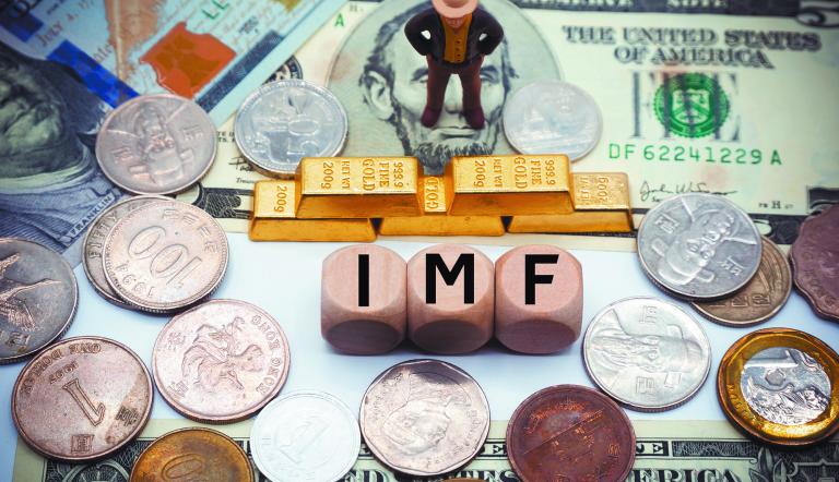 International Monetary Fund (IMF) is an international organization that promotes global economic growth and financial stability, encourages international trade.The word is written on money background
