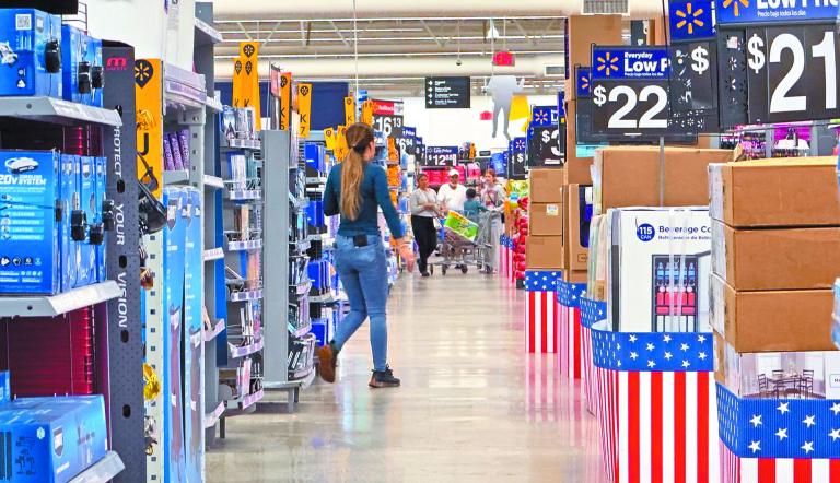 People walk at a Walmart store in Oceanside, California, U.S., May 15, 2025. REUTERS/Mike Blake