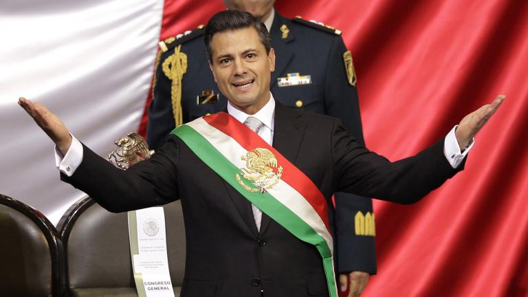 FILE - In this Dec. 1, 2012 file photo, Mexico's incoming President Enrique Pena Nieto of the Institutional Revolution Party, PRI, spreads out his arms after being sworn in at the inauguration ceremony in National Congress, in Mexico City. The PRI ruled Mexico for 71 years, despite accusations of stolen or bought elections, before being ousted in 2000 voting. When it returned to power in 2012 under President Pena Nieto, its leaders couldn't stop talking about how their party had changed. (AP Photo/Alexandre Meneghini, File) - DEC. 1, 2012 FILE PHOTO