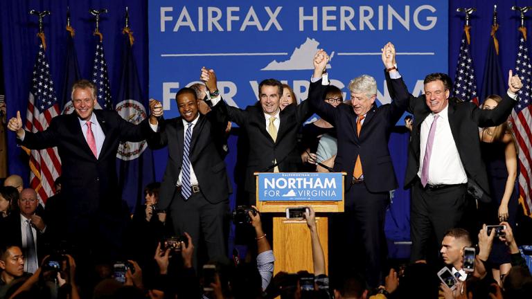 FILE PHOTO: Virginia Governor Elect Ralph Northam celebrates his election night rally in Fairfax - FILE PHOTO: Virginia Governor Elect Ralph Northam (C) celebrates with, left to right, Gov. Terry McAuliffe, Lt. Governor Elect Justin Fairfax, Attorney General Mark Herring and Sen. Mark Warner (D-VA), at his election night rally on the campus of George Mason University in Fairfax, Virginia, November 7, 2017. REUTERS/Aaron P. Bernstein/File Photo - NARCH/NARCH30