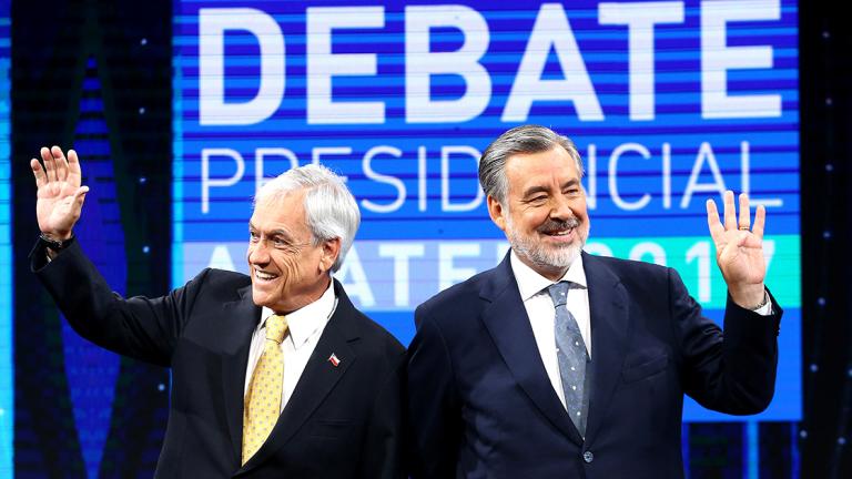 Chilean presidential candidates Alejandro Guillier and Sebastian Pinera attend a live televised debate in Santiago, - Chilean presidential candidates Alejandro Guillier and Sebastian Pinera attend a live televised debate in Santiago, Chile December 11, 2017. REUTERS/Ivan Alvarado