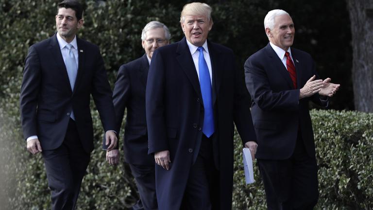 President Donald Trump walks with Vice President Mike Pence, House Speaker Paul Ryan, R-Wis., and Senate Majority Leader Mitch McConnell, R-Ky. during a bill passage event on the South Lawn of the White House in Washington, Wednesday, Dec. 20, 2017, to acknowledge the final passage of tax overhaul legislation by Congress. (AP Photo/Evan Vucci)