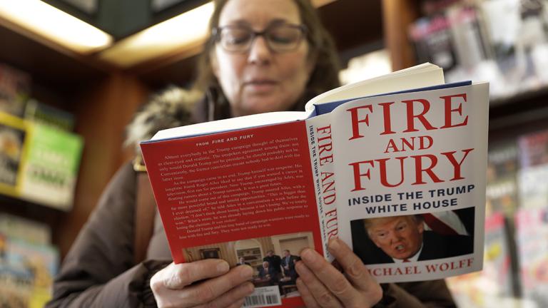 Kathy Mallin - CORRECTS FIRST NAME TO KATHY, NOT SUSAN - Kathy Mallin, from Glenview, Ill., looks over a copy of the book "Fire and Fury: Inside the Trump White House" by Michael Wolff at Barbara