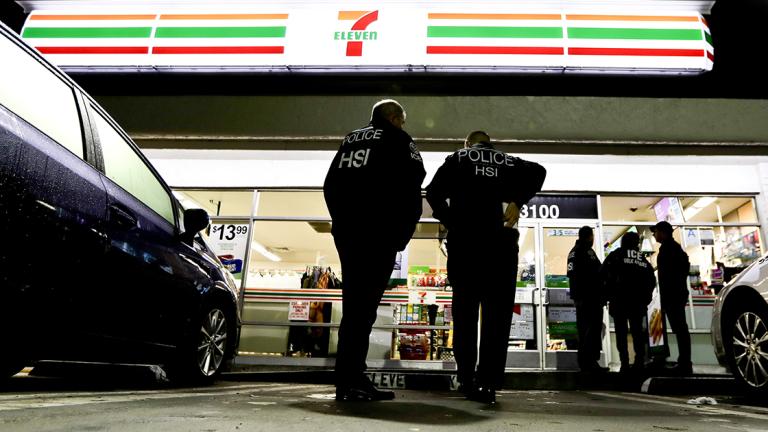 U.S. Immigration and Customs Enforcement agents serve an employment audit notice at a 7-Eleven convenience store Wednesday, Jan. 10, 2018, in Los Angeles. Agents said they targeted about 100 7-Eleven stores nationwide Wednesday to open employment audits and interview workers. (AP Photo/Chris Carlson)