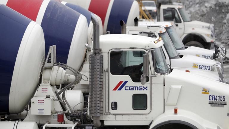 Concrete mixer trucks are lined up at a concrete plant of Mexican cement maker CEMEX, in Monterrey February 24, 2015. REUTERS/Daniel Becerril (MEXICO - Tags: BUSINESS CONSTRUCTION) - RTR4R1YL