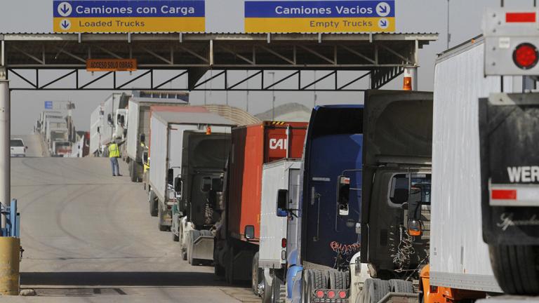 FILE PHOTO - Trucks wait in a long queue for border customs control to cross into the U.S. at the Otay border crossing in Tijuana - FILE PHOTO - Trucks wait in a long queue for border customs control to cross into the U.S. at the Otay border crossing in Tijuana, Mexico on February 2, 2017. REUTERS/Jorge Duenes/File Photo - NARCH/NARCH30